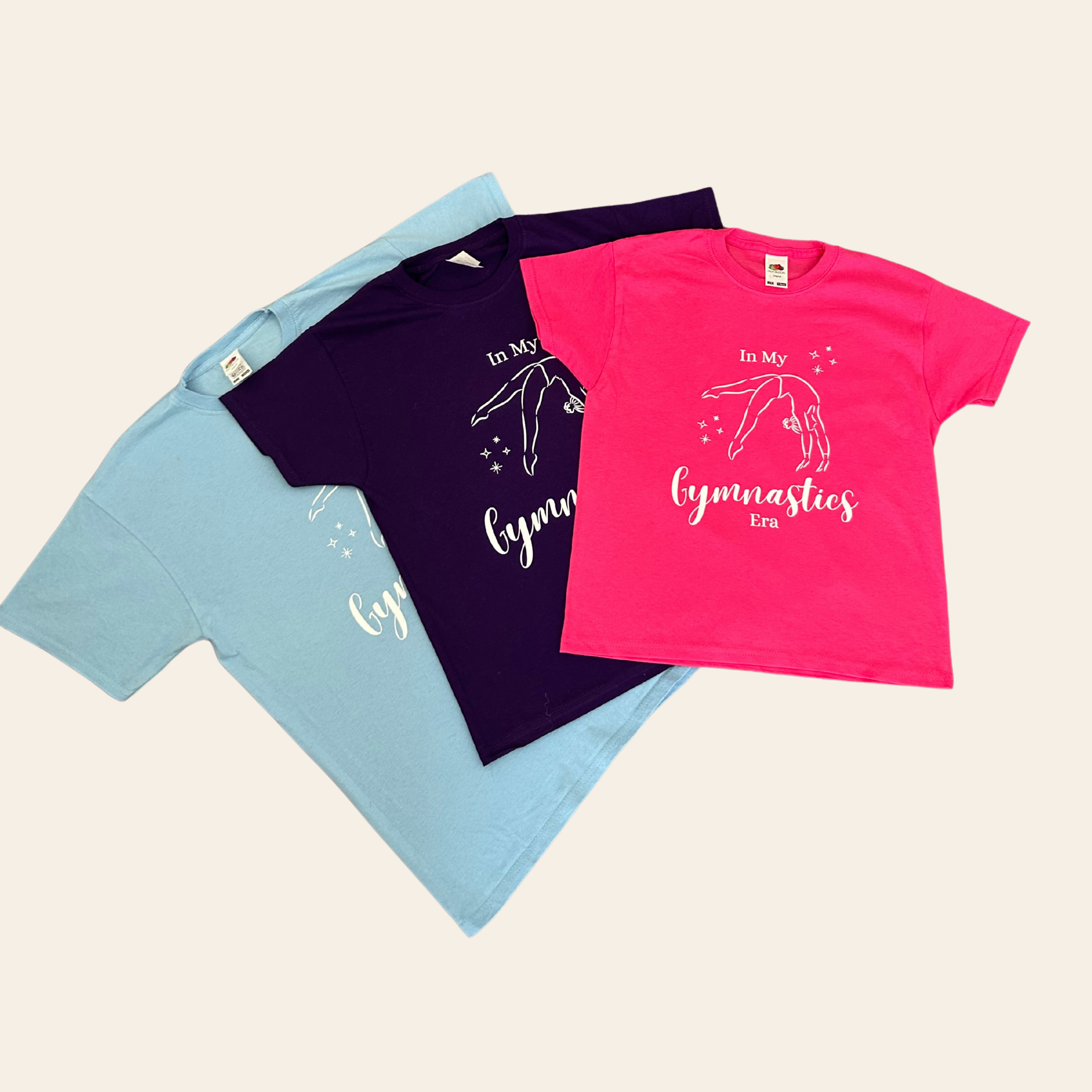 Personalised gymnastics t-shirt in pink, blue and purple with gymnast design