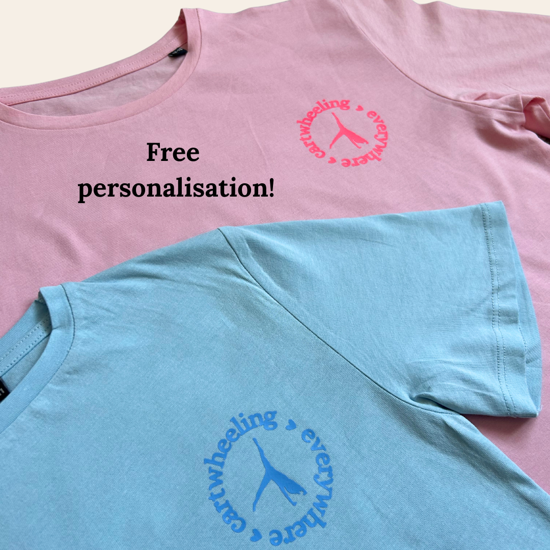 Pink and blue gymnastics t-shirts with cartwheeling everywhere design and text on a light background