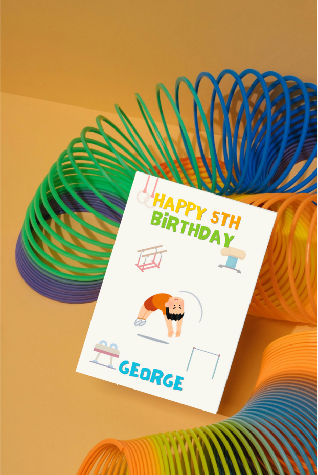 Colourful slinky toy with a gymnastics birthday card for boys on a orange background