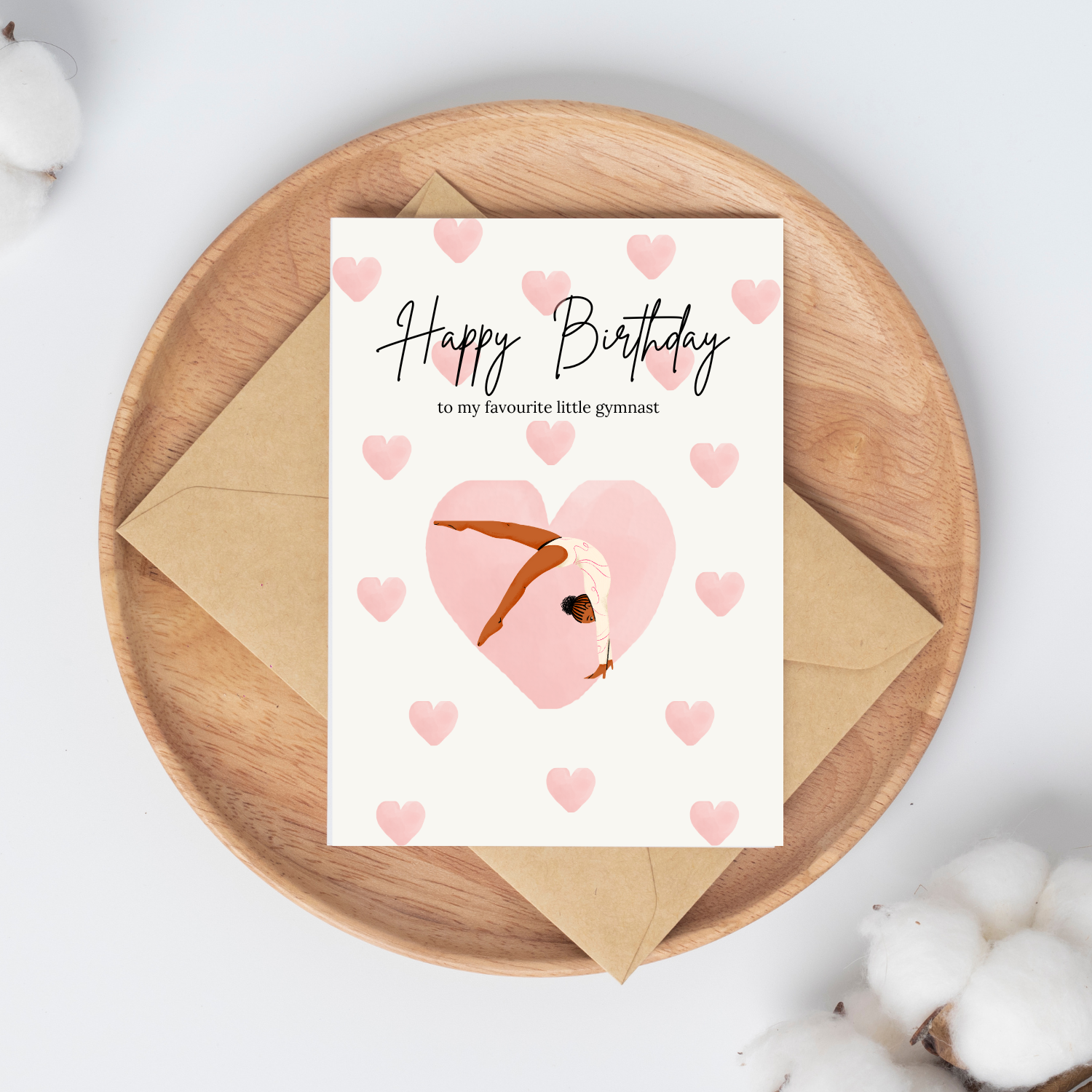 Gymnastics birthday card for girls with a gymnast design on a wooden plate with an envelope