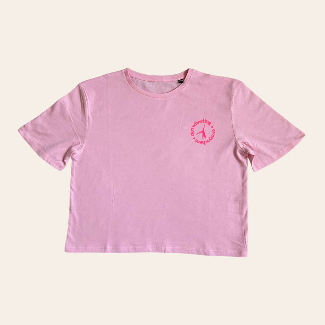 Pink t-shirt gift for gymnast with a cartwheel design on a beige background
