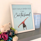 Framed gymnastics print with a girl doing a cartwheel and text 'Why walk when you can cartwheel' on a shelf with a teddy bear and mug.