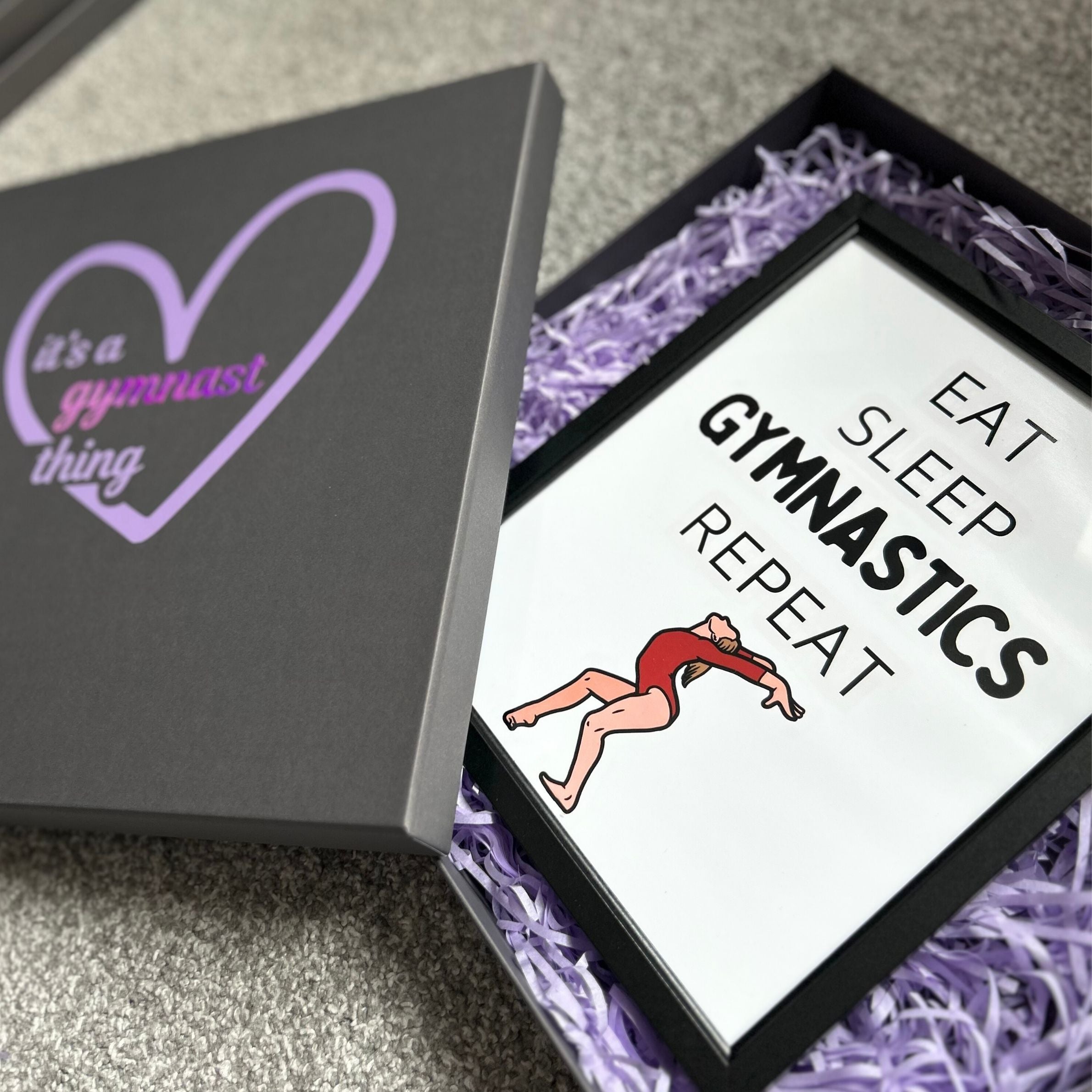 Gymnastics gift box with 'it's a gymnast thing' text and 'Eat Sleep Gymnastics Repeat' print.