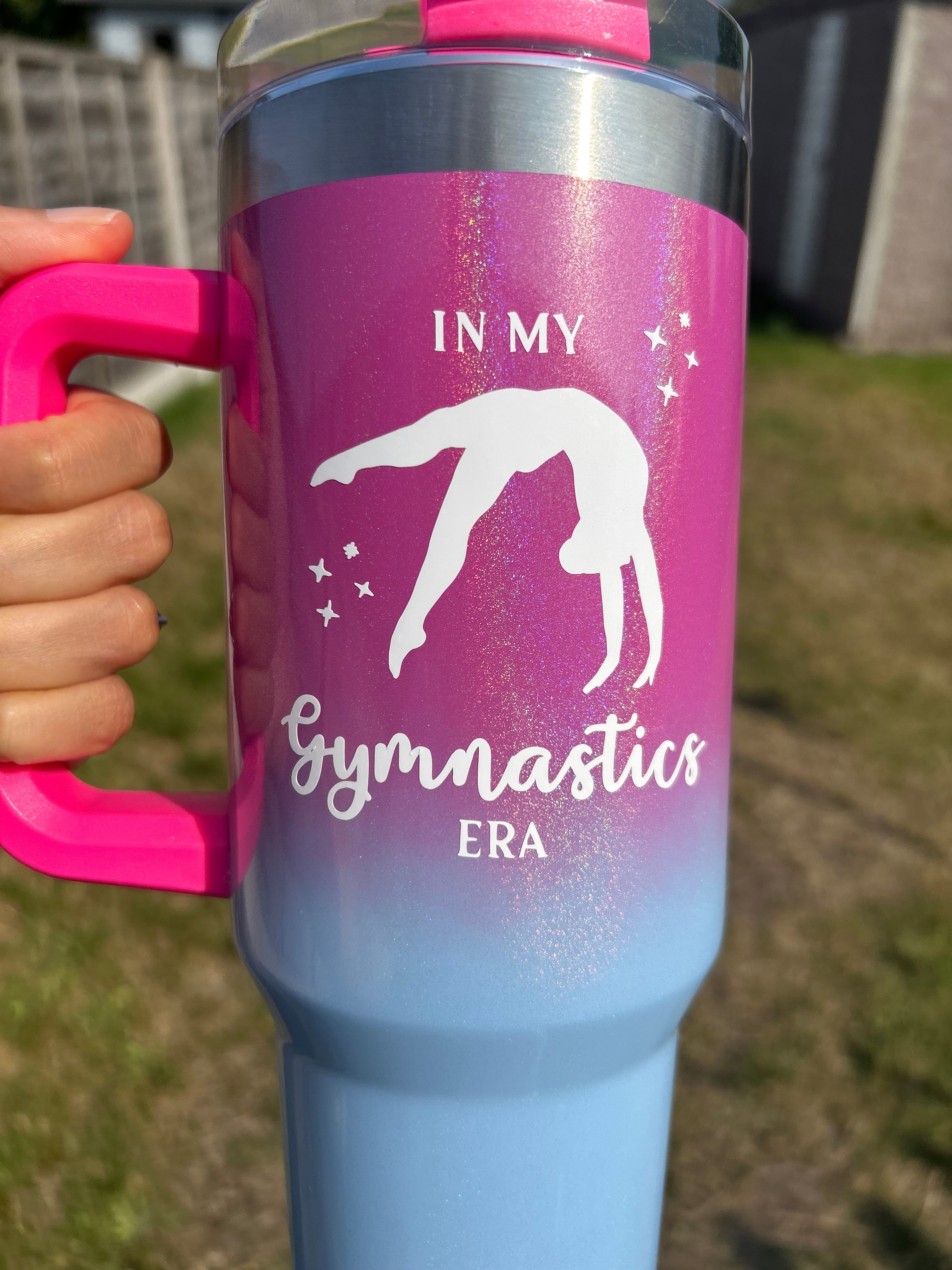 Pink and blue gymnastics water bottle with 'In My Gymnastics Era' text and a gymnast silhouette.