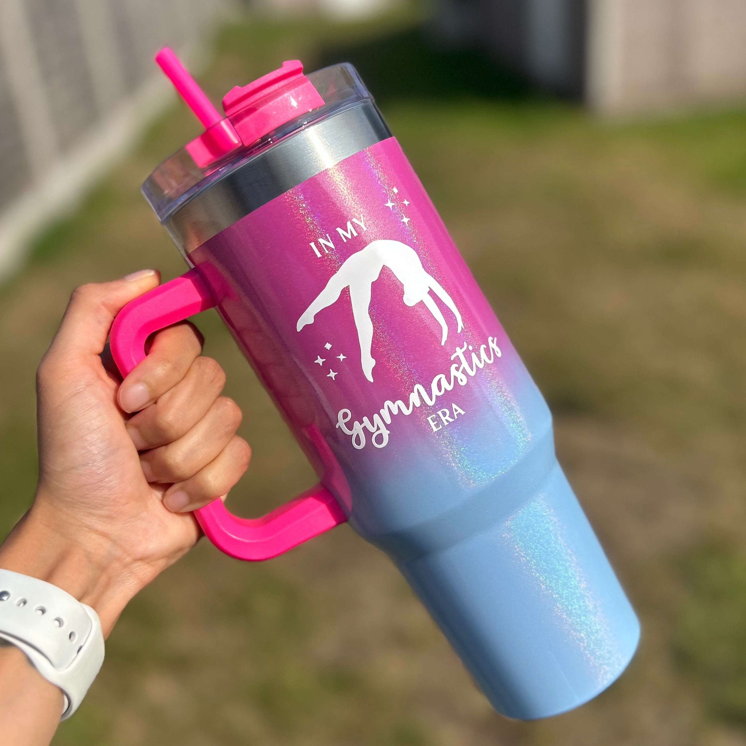 Blue and pink shimmer 40oz tumbler with text 'in my gymnastics era' and back handspring graphic 