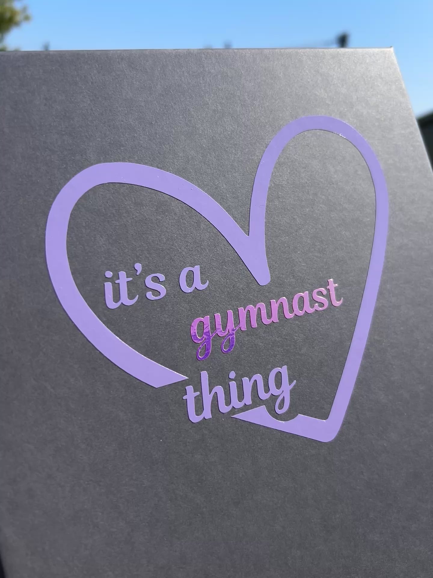 Lilac heart on grey gift box for gymnasts