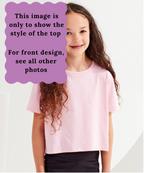 Young girl wearing a pink boxy t-shirt with a purple text box overlay.